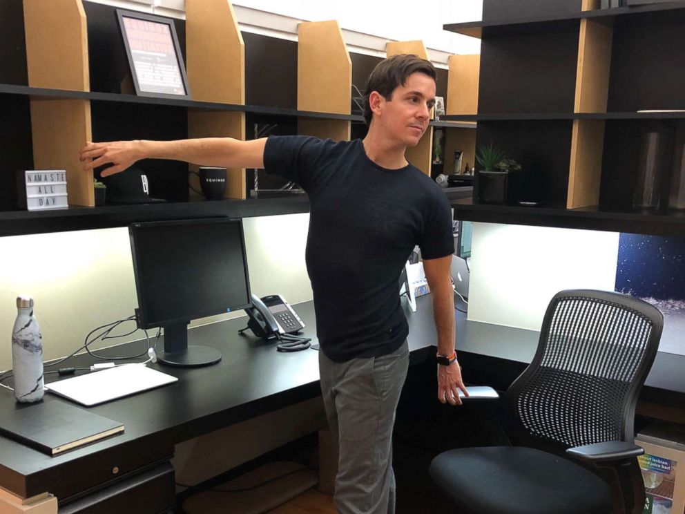 PHOTO: A standing twist pose is demonstrated.