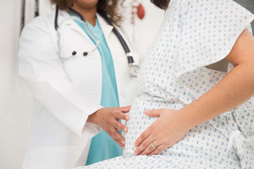 PHOTO: A stock photo of a doctor with a pregnant patient.