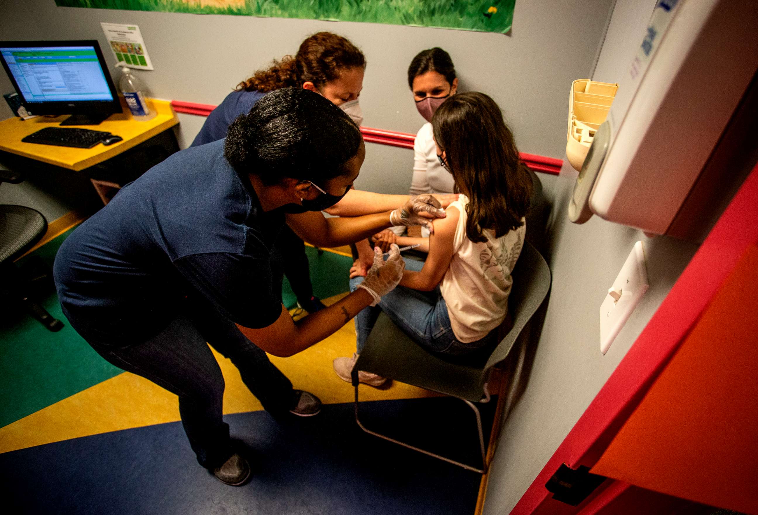 PHOTO: Middle school student Elise Robinson receives her first coronavirus vaccination on Wednesday, May 12, 2021, in Decatur, Ga.