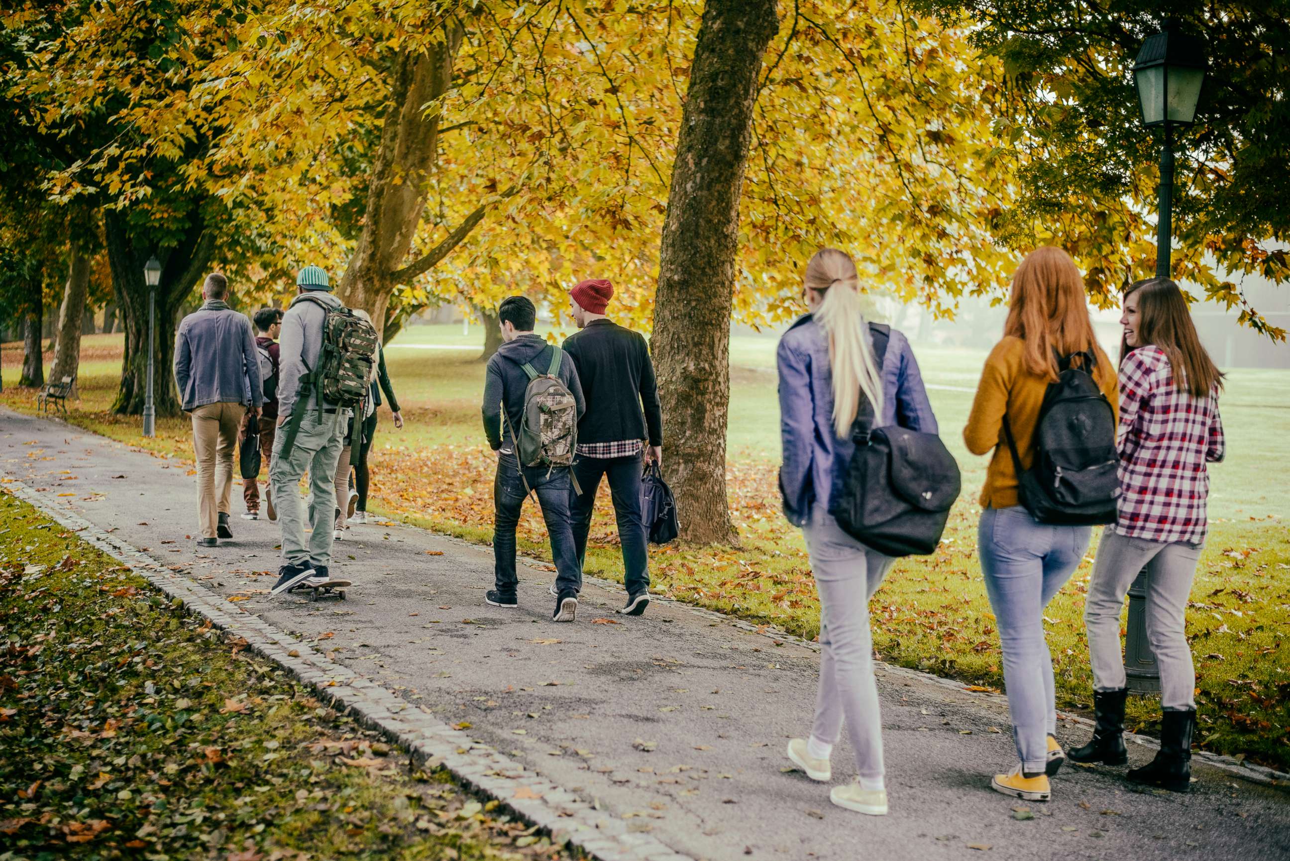 PHOTO: In this undated file photo, students walk through a park in autumn.
