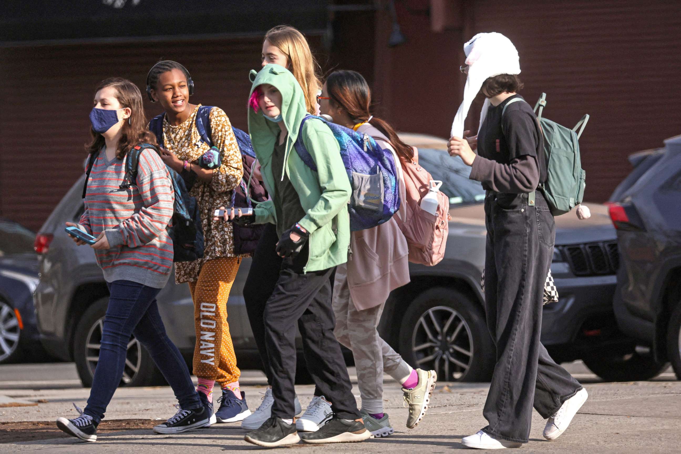PHOTO: Children are seen walking to school, on the first day of lifting the indoor mask mandate for DOE schools between K through 12, in the Brooklyn borough of New York City, March 7, 2022.