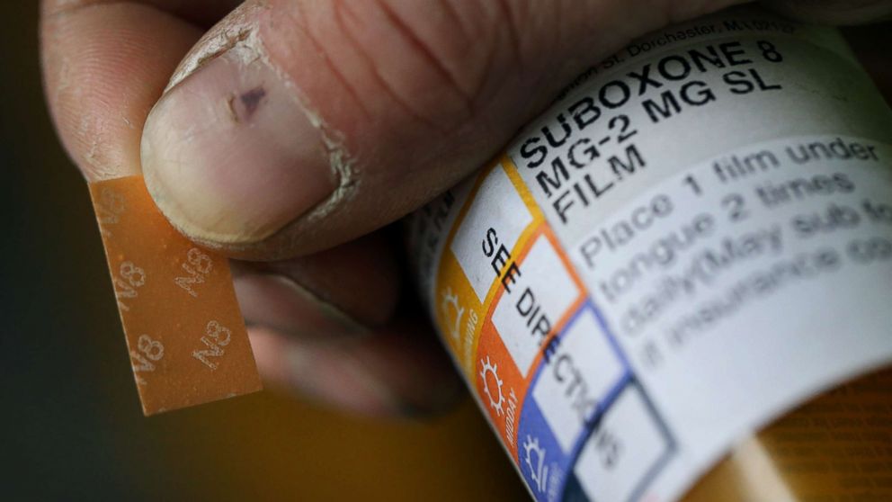 A patient displays his Suboxone prescription following his appointment at the Substance Use Disorders Bridge Clinic at Massachusetts General Hospital in Boston, April 27, 2018.
