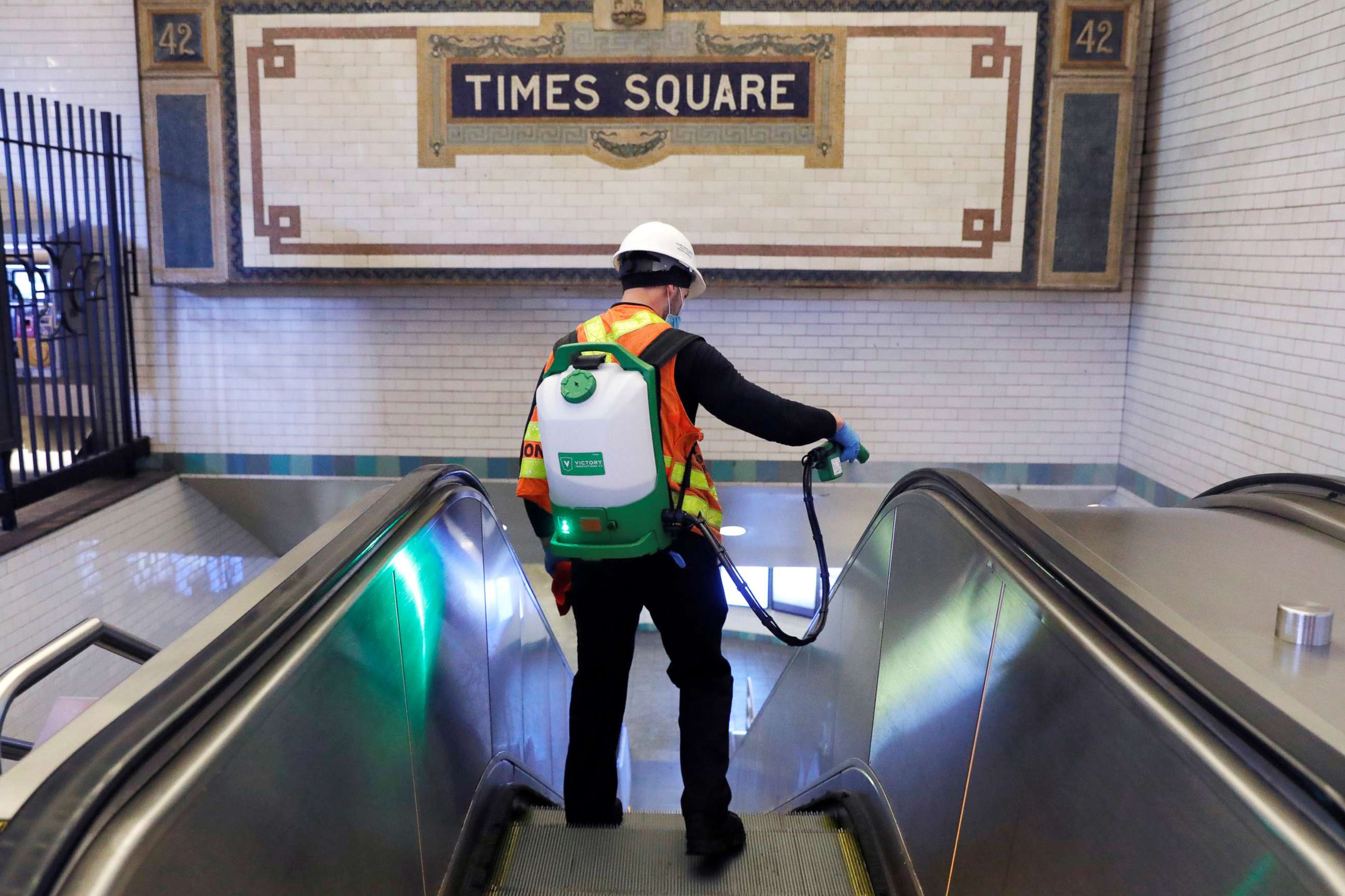 PHOTO:A worker sprays an escalator handrail as the MTA Subway closed overnight for cleaning and disinfecting during the outbreak of coronavirus in New York, May 6, 2020. 