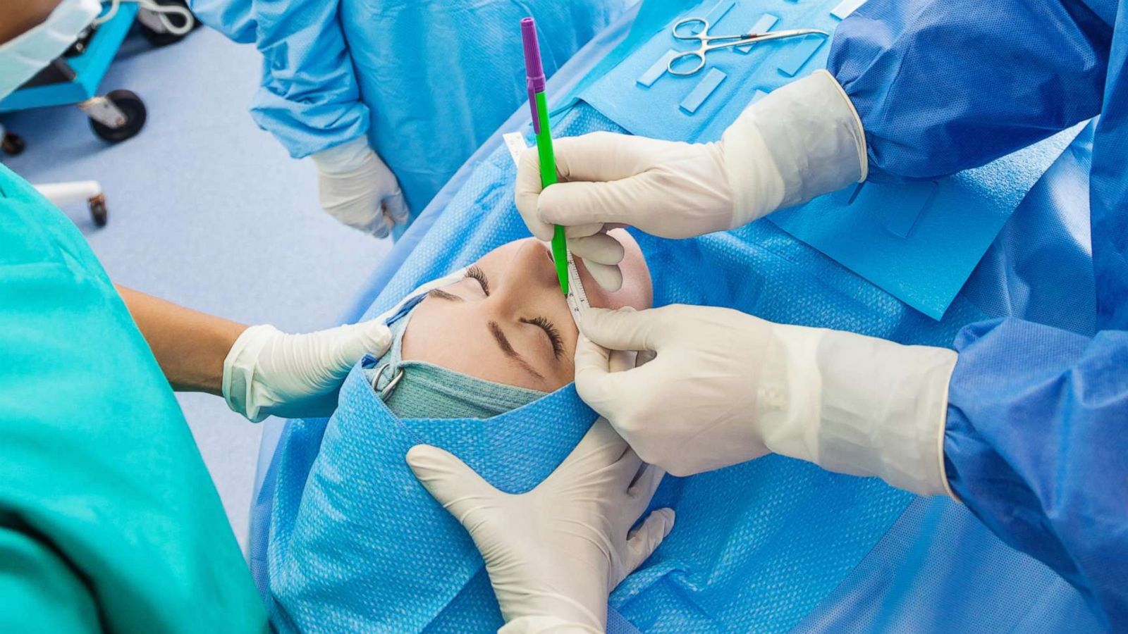 PHOTO: Surgeons operate on a patient during a cosmetic surgery procedure in this undated stock photo.