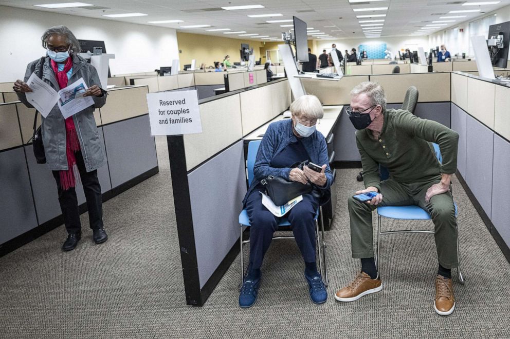 PHOTO: People wait in a observation area after receiving a dose of the Pfizer-BioNTech Covid-19 vaccine at a Sutter Health vaccination site in Sacramento, Calif., on Feb. 4, 2021.