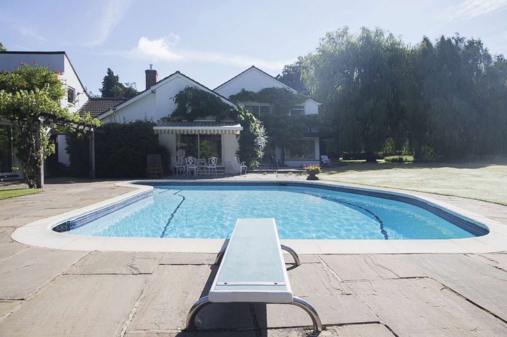 PHOTO: Diving board at the edge of swimming pool