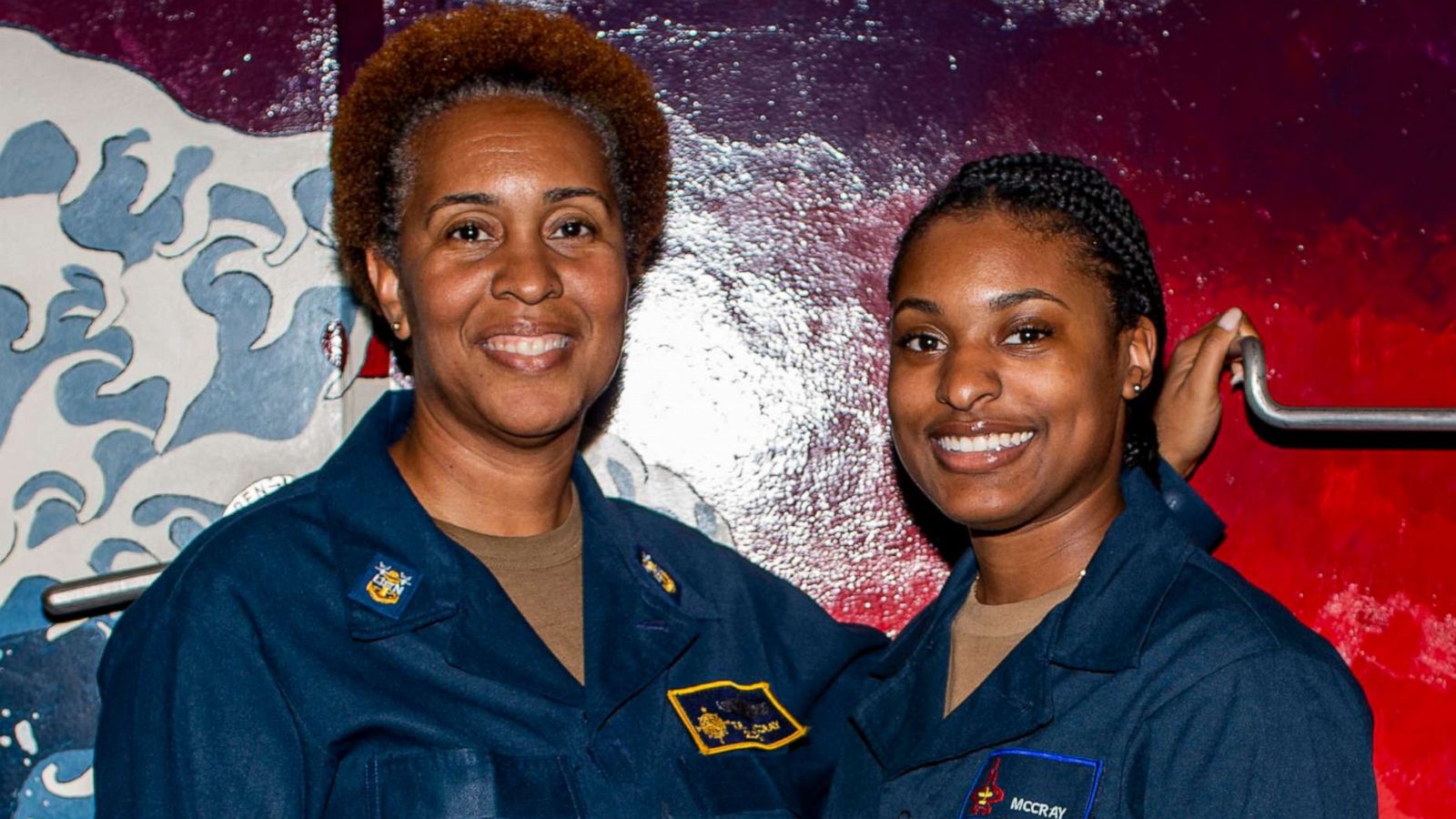 PHOTO: Master Chief Logistics Specialist Tonya McCray poses for a photo with her daughter, Logistic Specialist Seaman Racquel McCray, while they both serve aboard the USS Gerald R. Ford, July 17, 2021.