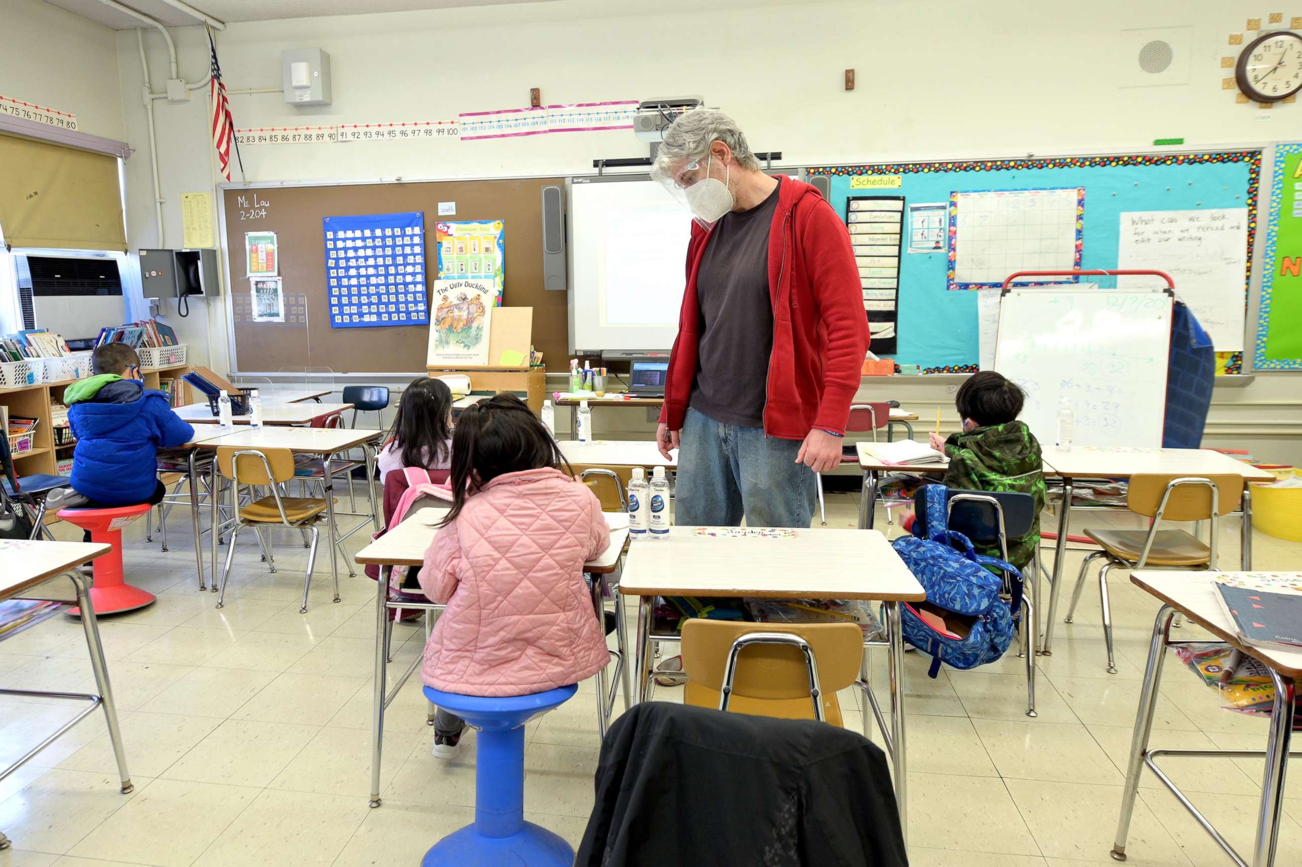 PHOTO: A teacher speaks to students at Yung Wing School P.S. 124 in New York on Dec. 7, 2020.