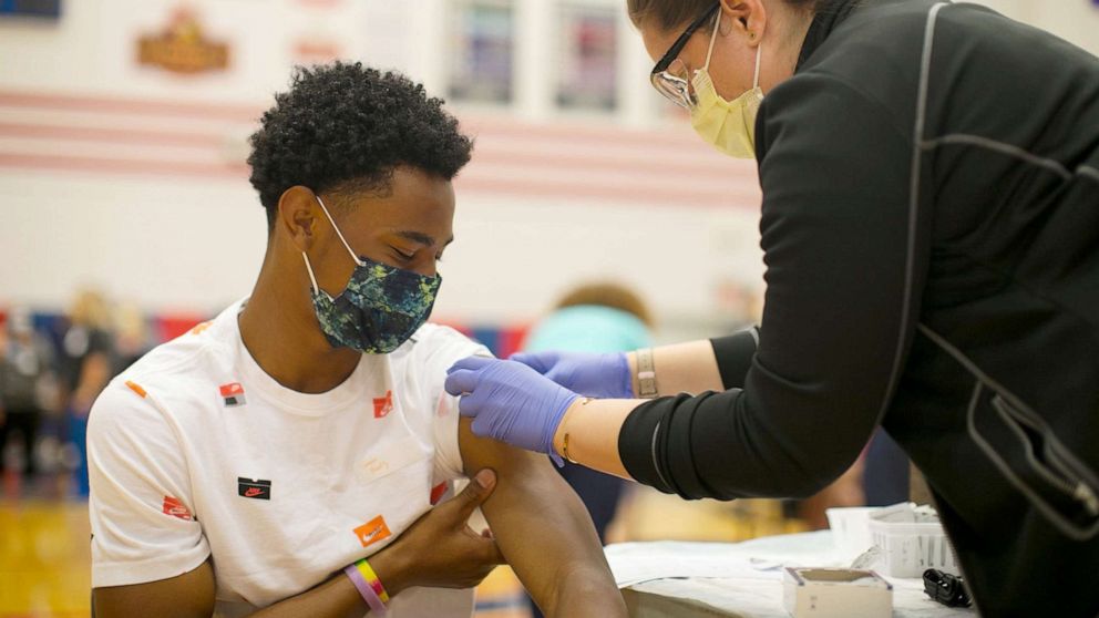 PHOTO: Camden Beatty, 17, receives his first COVID vaccine at Thomas Worthington High School Wednesday, April 7, 2021, through Nationwide Children's Hospital's vaccine clinics for teenagers in Columbus, Ohio, April 7, 2021.