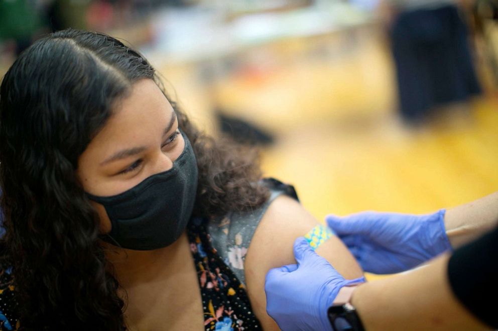 PHOTO: Kylee Cannon, 17, receives her first COVID vaccine, at Thomas Worthington High School through Nationwide Children's Hospital's vaccine clinics for teenagers in Columbus, Ohio, April 9, 2021.