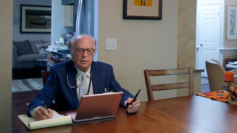 PHOTO: Dr. Neil Handelman meets with a patient remotely during a telemedicine appointment to discuss and diagnose possible coronavirus symptoms from his home in San Rafael, Calif. on March 27, 2020.