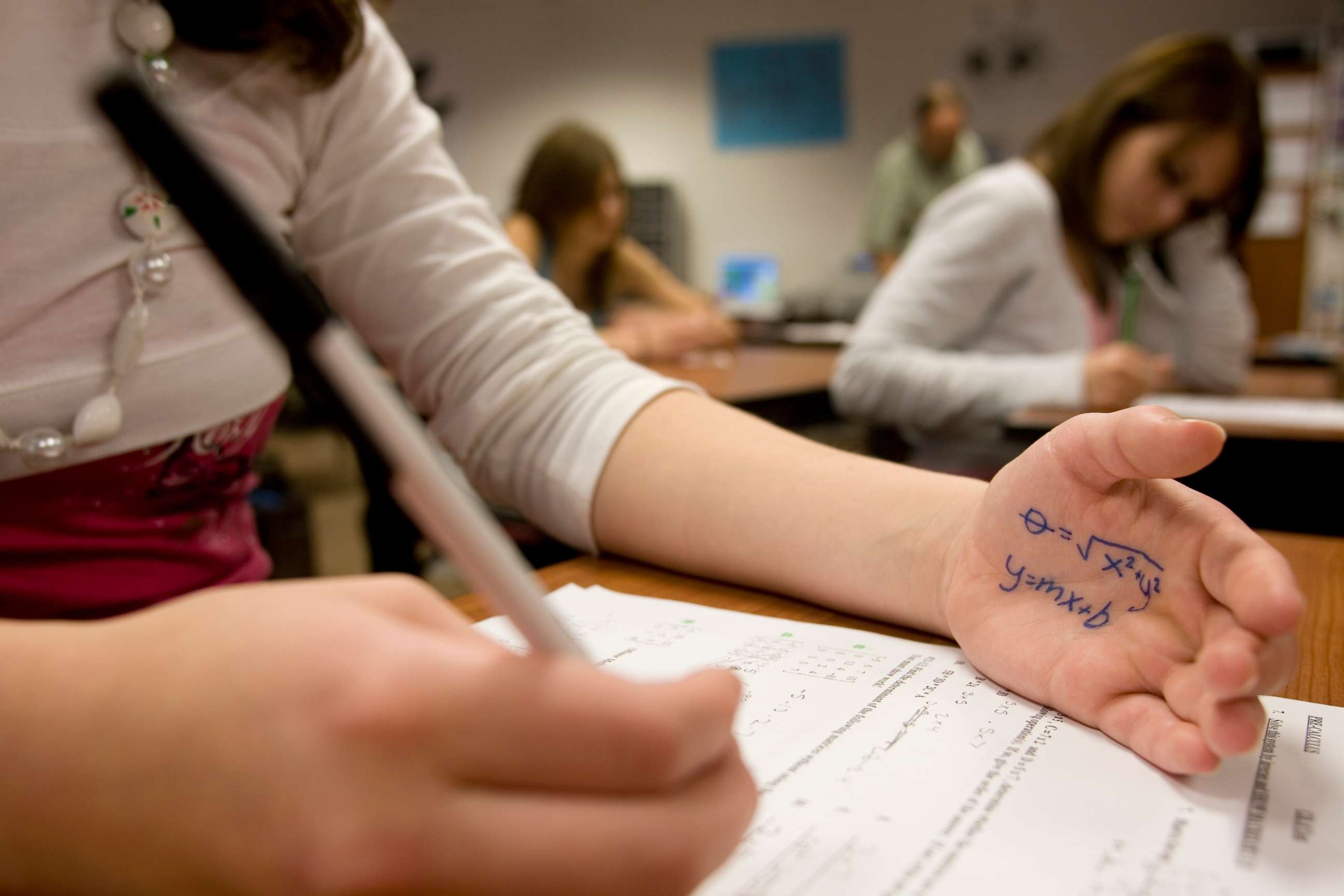 PHOTO: A student cheats on a test in this stock photo.