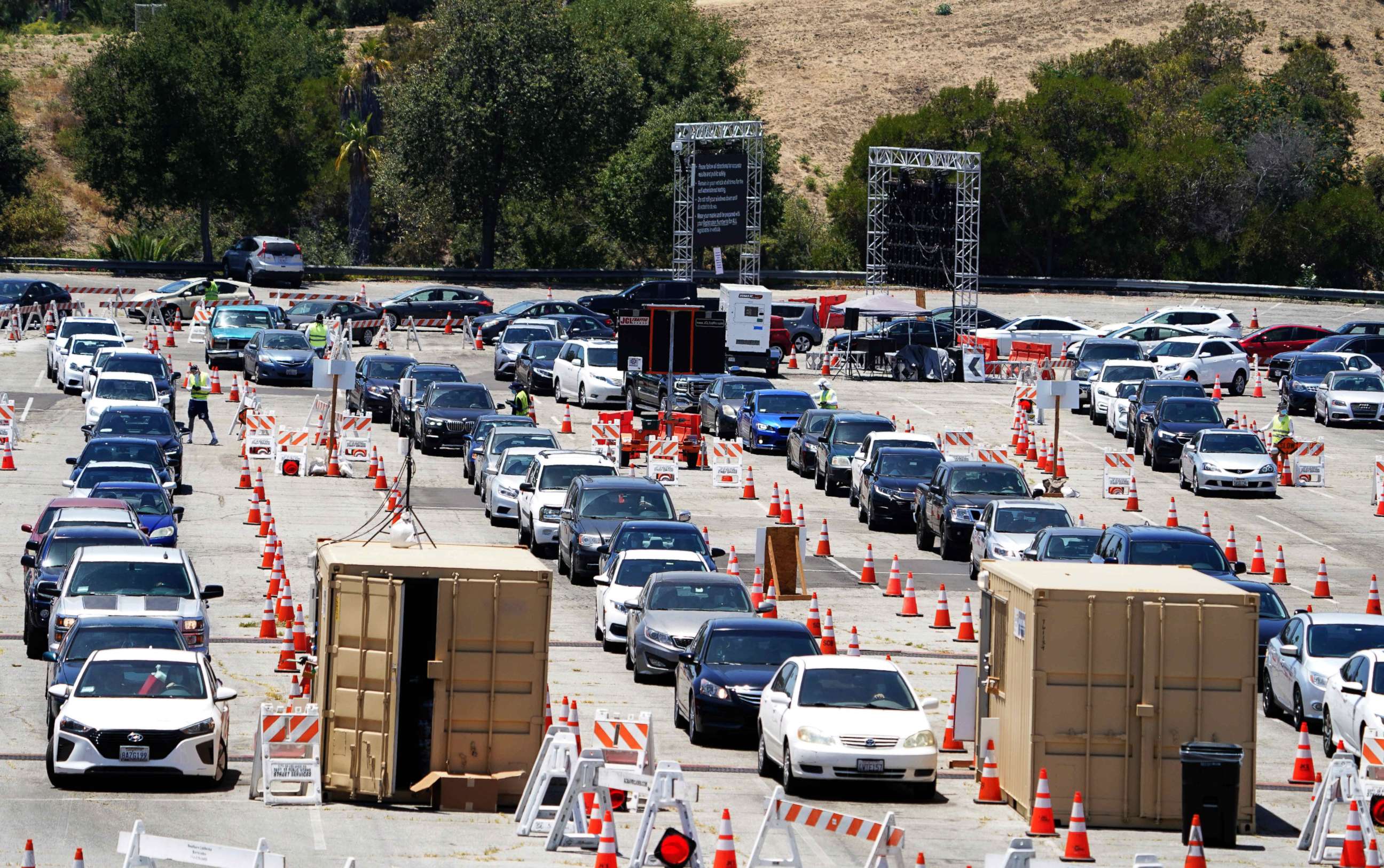 PHOTO: Cars enter the coronavirus COVID-19 testing site at Dodger Stadium, July 13, 2020, in Los Angeles, California.