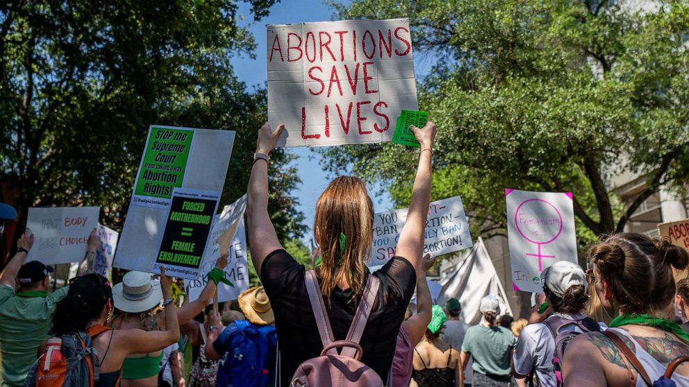 PHOTO: Abortion rights activists and supporters march outside of the Austin Convention Center on May 14, 2022 in Austin, Texas.