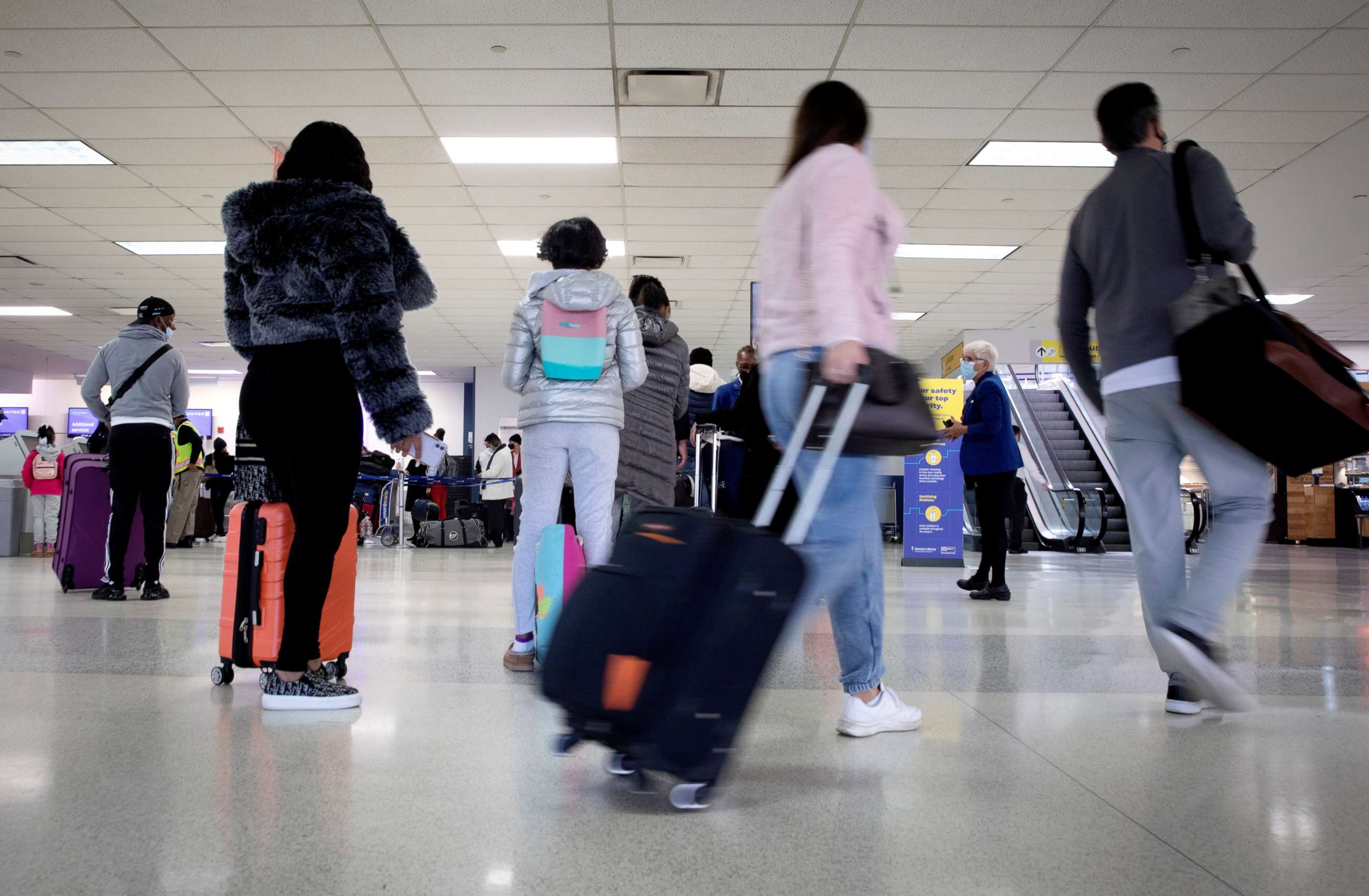 PHOTO: Travelers arrive to check in for flights ahead of the Thanksgiving holiday at Newark International Airport in Newark, N.J., Nov. 25, 2020.