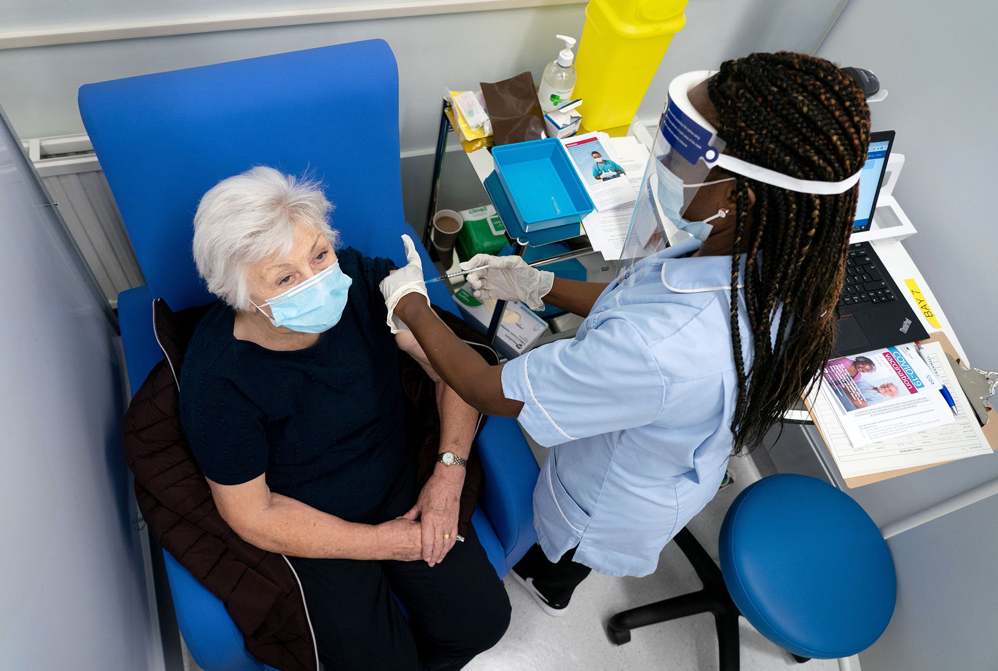 PHOTO: Anne Irene reacts as she receives a dose of the Pfizer/BioNTech Covid-19 vaccine in south London on Dec. 8, 2020.