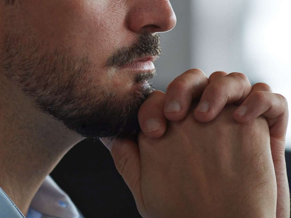 PHOTO: A man looks out the window in an undated stock photo.
