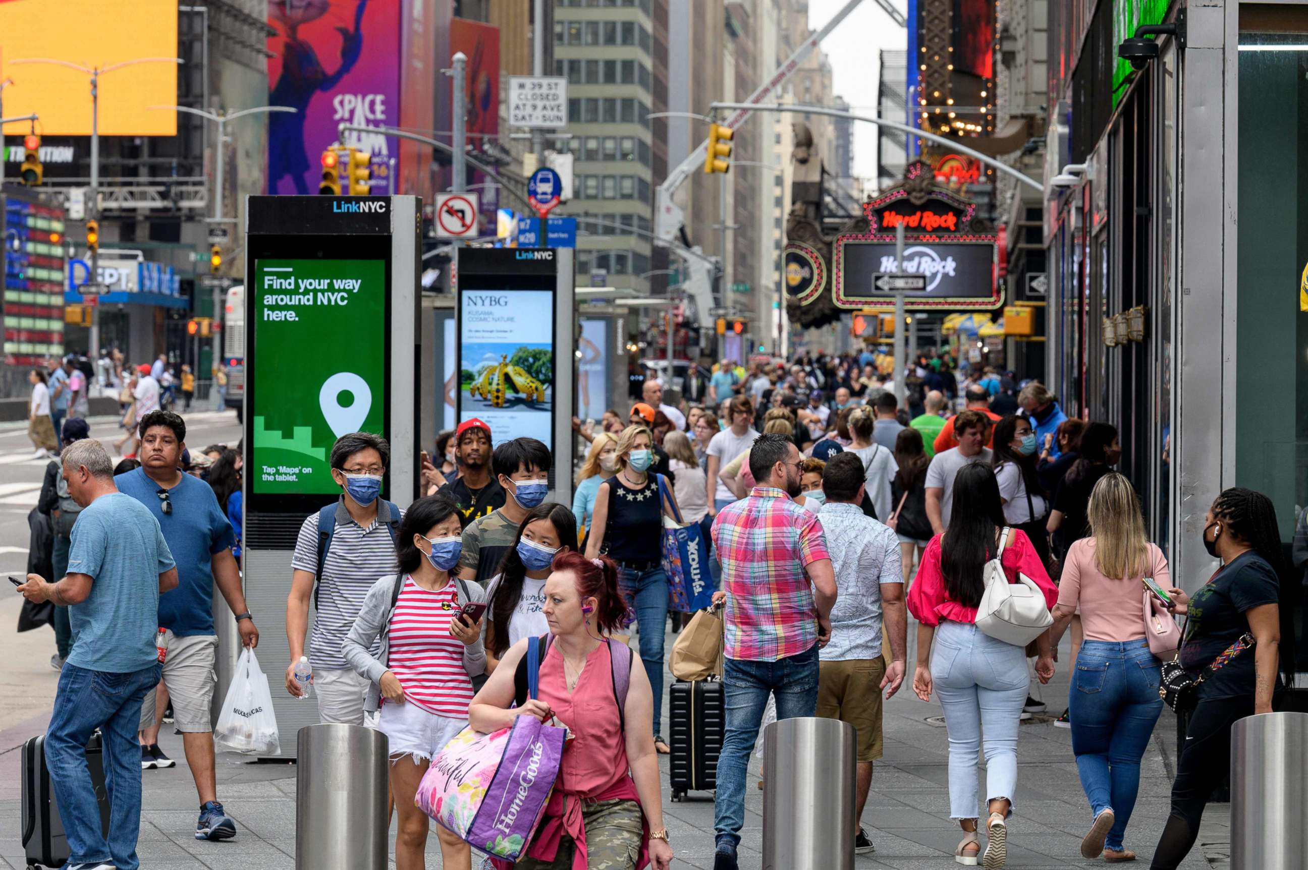 PHOTO: In this July 13, 2021, file photo, people walk through Times Square in New York.