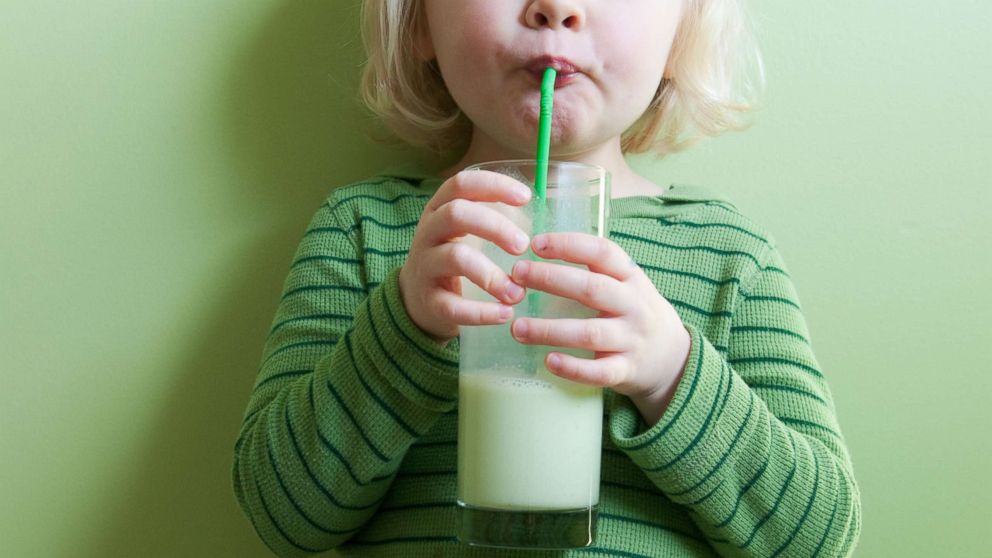 PHOTO: A toddler girl sips a drink through a straw in this undated stock photo.