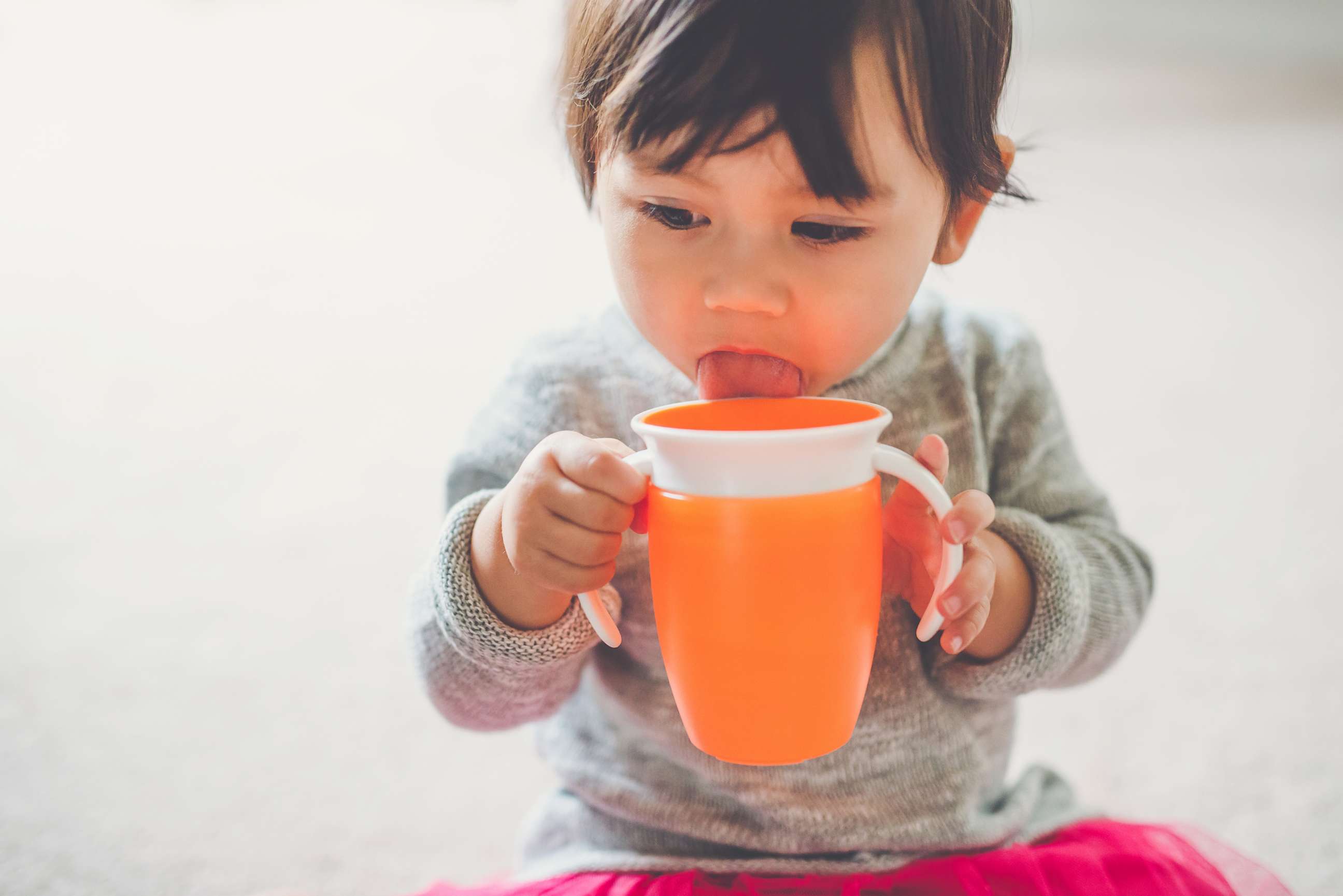 PHOTO: A toddler girl drinks from her sippy cup in this undated stock photo.
