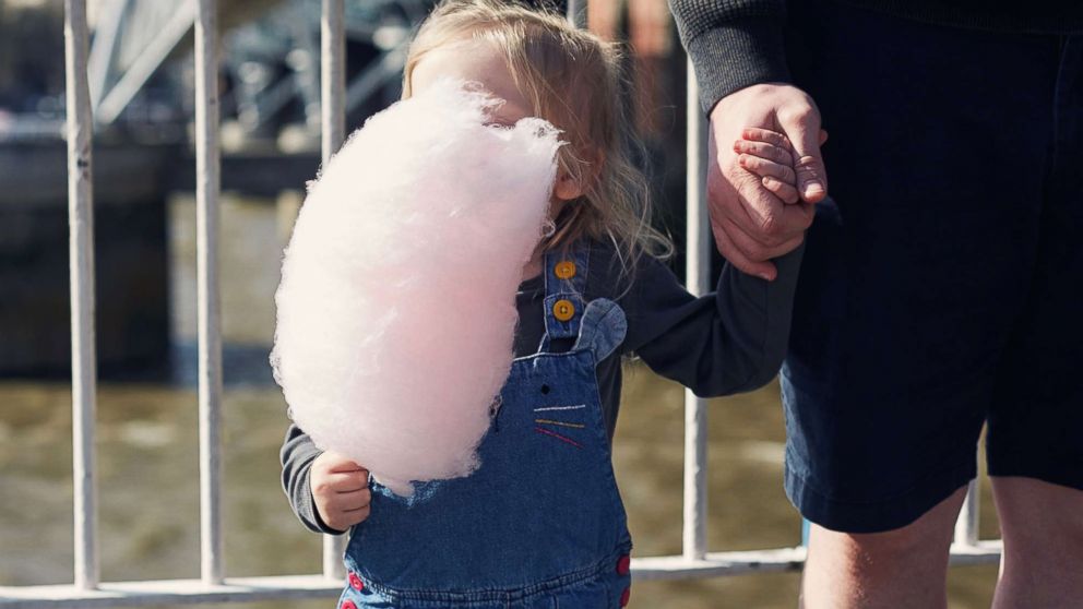 PHOTO: A young girl eats cotton candy in an undated stock photo.