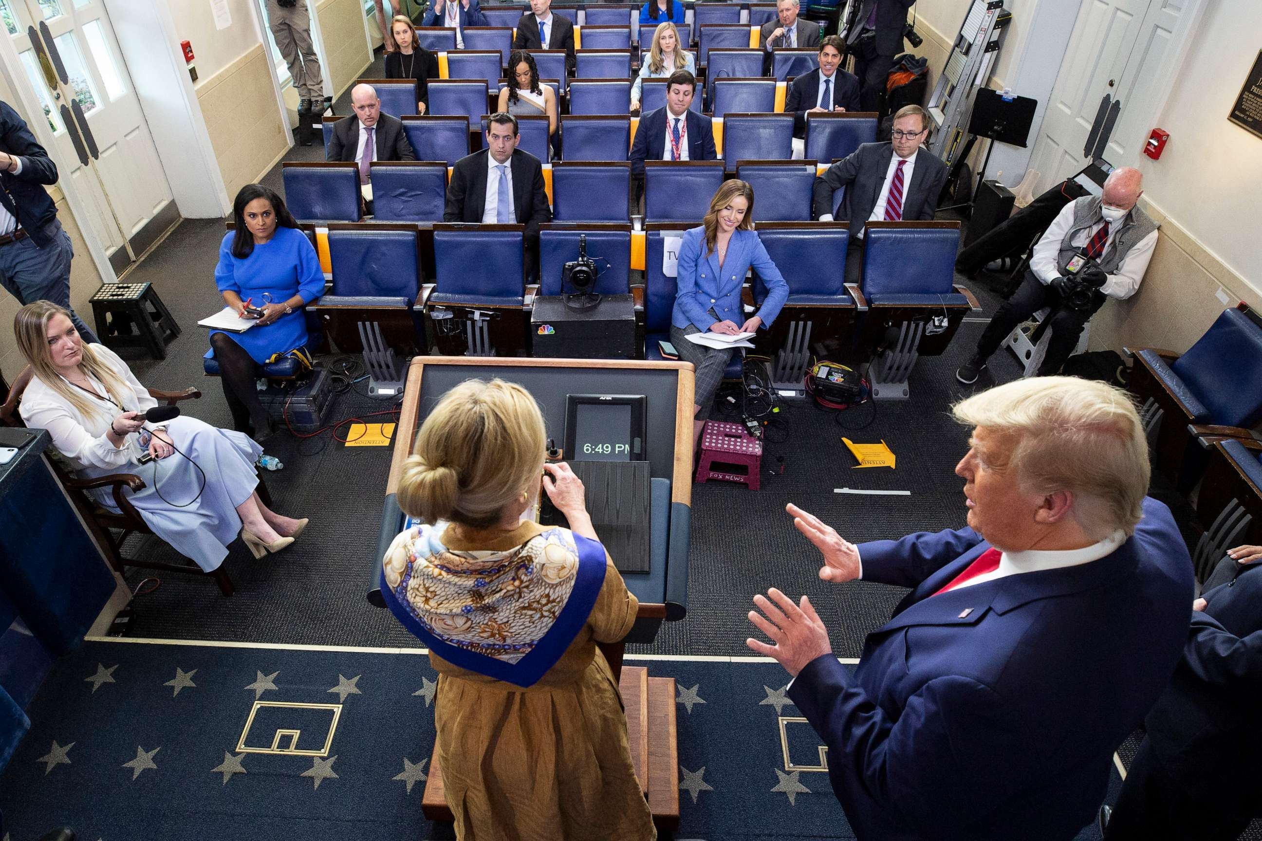 PHOTO: President Donald Trump, right, reacts as Dr. Deborah Birx speaks about her granddaughter's fever as she speaks about the coronavirus at the White House, April 6, 2020, in Washington.