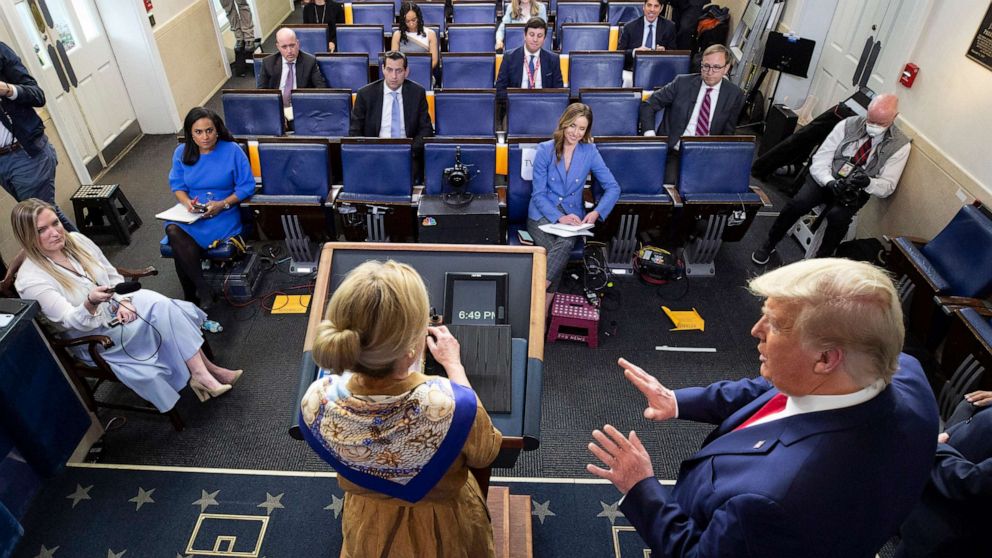 PHOTO: President Donald Trump, right, reacts as Dr. Deborah Birx speaks about her granddaughter's fever as she speaks about the coronavirus at the White House, April 6, 2020, in Washington.