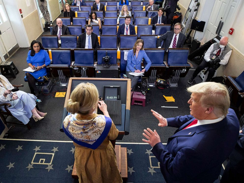 PHOTO: President Donald Trump, right, reacts as Dr. Deborah Birx speaks about her granddaughters fever as she speaks about the coronavirus at the White House, April 6, 2020, in Washington.