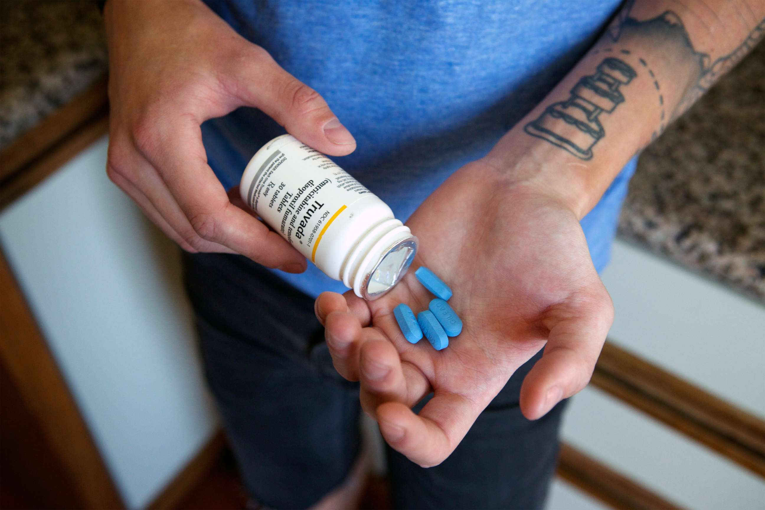 PHOTO: An activist with the San Francisco AIDS Foundation takes his dose of Truvada, a antiretroviral shown to prevent new HIV infections, in San Francisco on May 14, 2014.