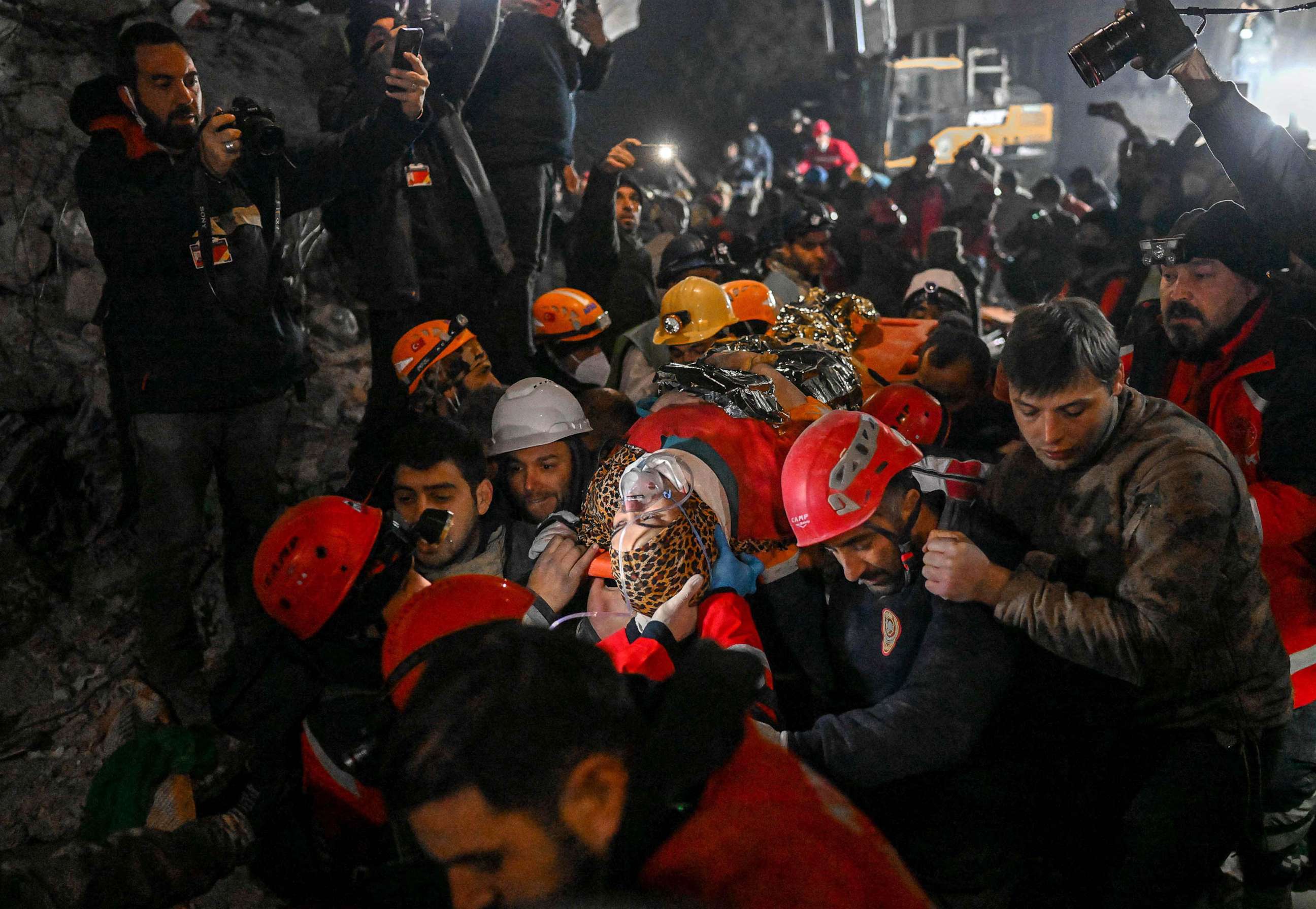 PHOTO: Seher, a 15 year-old Syrian woman saved by rescue workers from under the rubble after 210 hours, is carried to an ambulance in Hatay, southeastern Turkey, Feb. 14, 2023, a week after a deadly earthquake struck parts of Turkey and Syria.