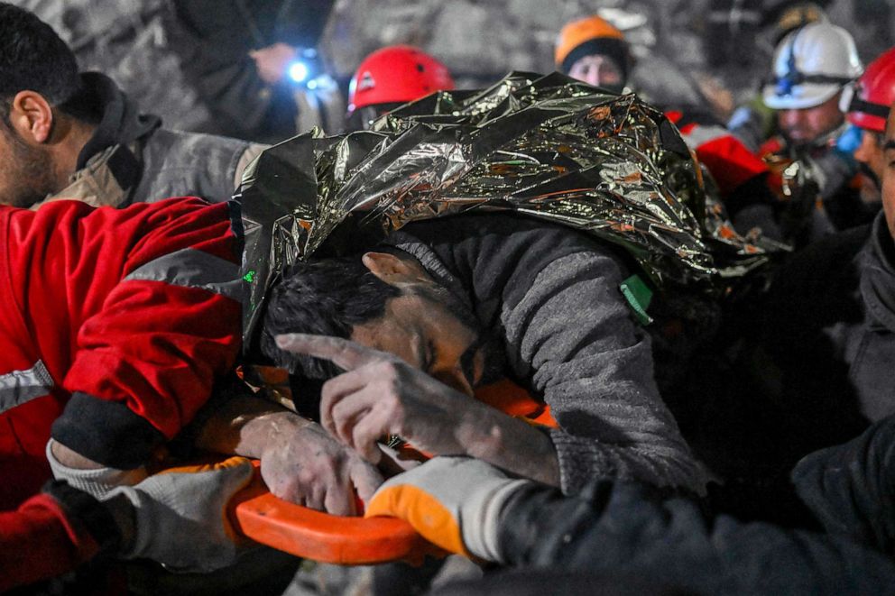 PHOTO: Syrian man Faez Ghanam saved by rescue workers from under the rubble after 210 hours, is carried to an ambulance in Hatay, southeastern Turkey, Feb. 14, 2023, a week after a deadly earthquake struck parts of Turkey and Syria.