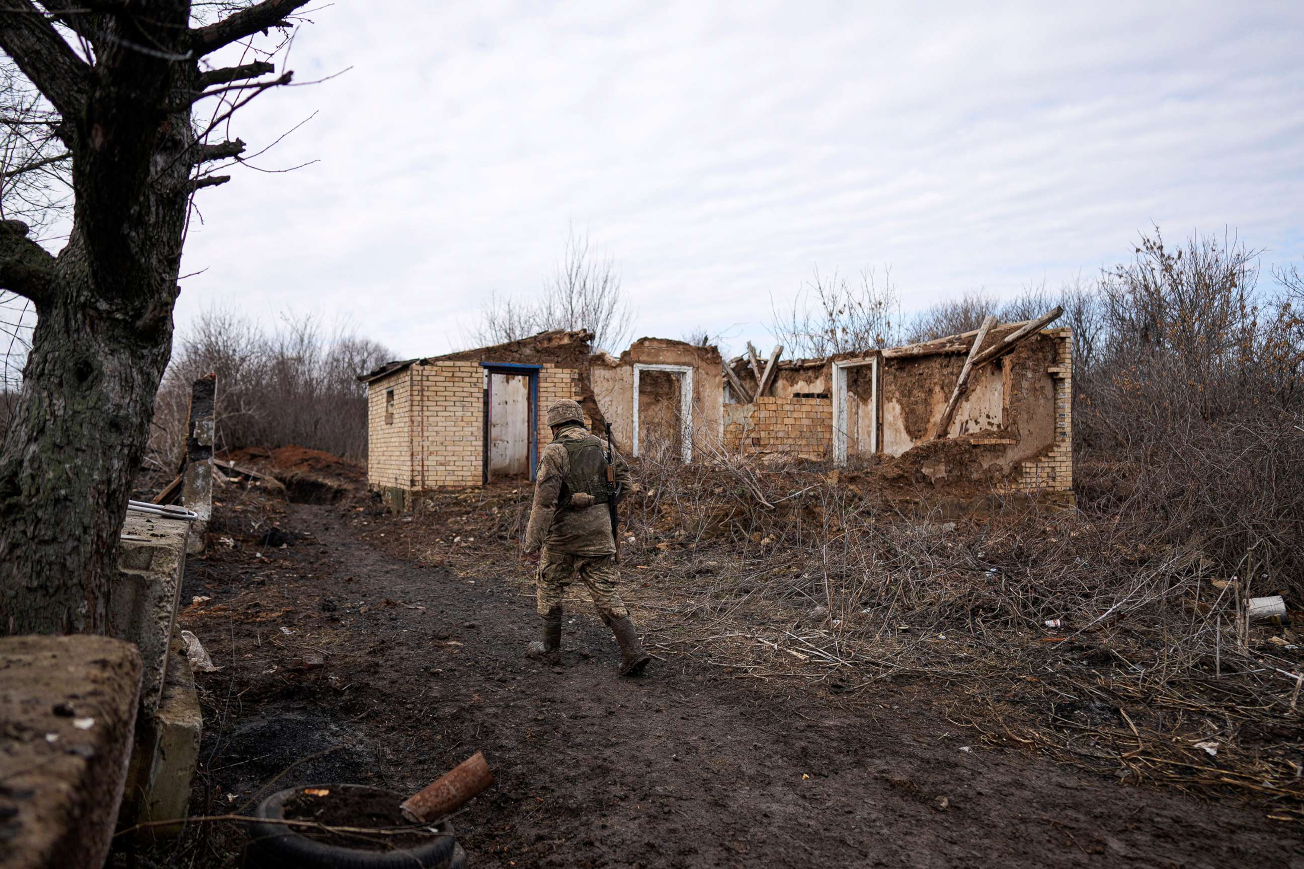 PHOTO: A Ukrainian serviceman patrols an area near his position at the line of separation between Ukraine-held territory and rebel-held territory near Svitlodarsk, eastern Ukraine, on Feb. 23, 2022.