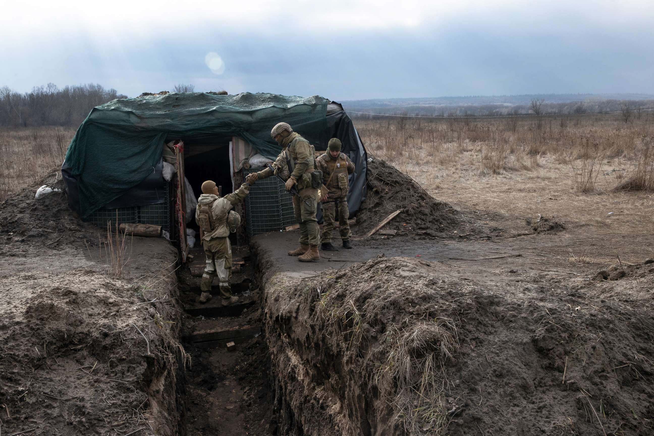 PHOTO: Ukrainian soldiers stand at a front line position in Kryakivka, in eastern Ukraine, on Feb. 22, 2022.