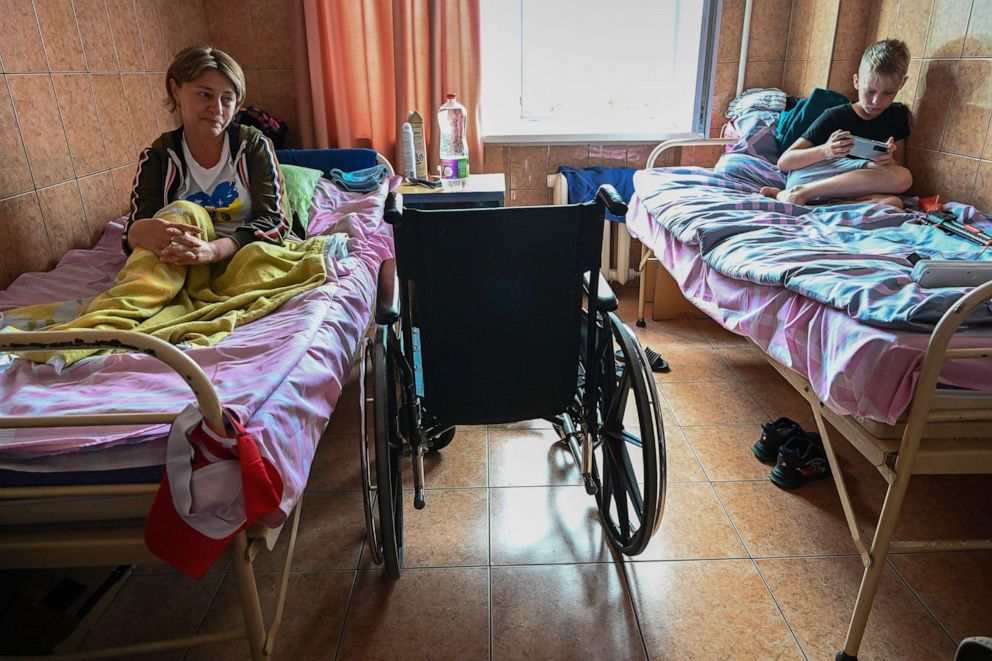 PHOTO: In this June 17, 2022, file photo, Natalia Stepanenko recovers after losing part of her left leg during a Russian cluster munition attack on a train station, with her son Yaroslav, 11, at the City Clinical Hospital for Children in Lviv, Ukraine.