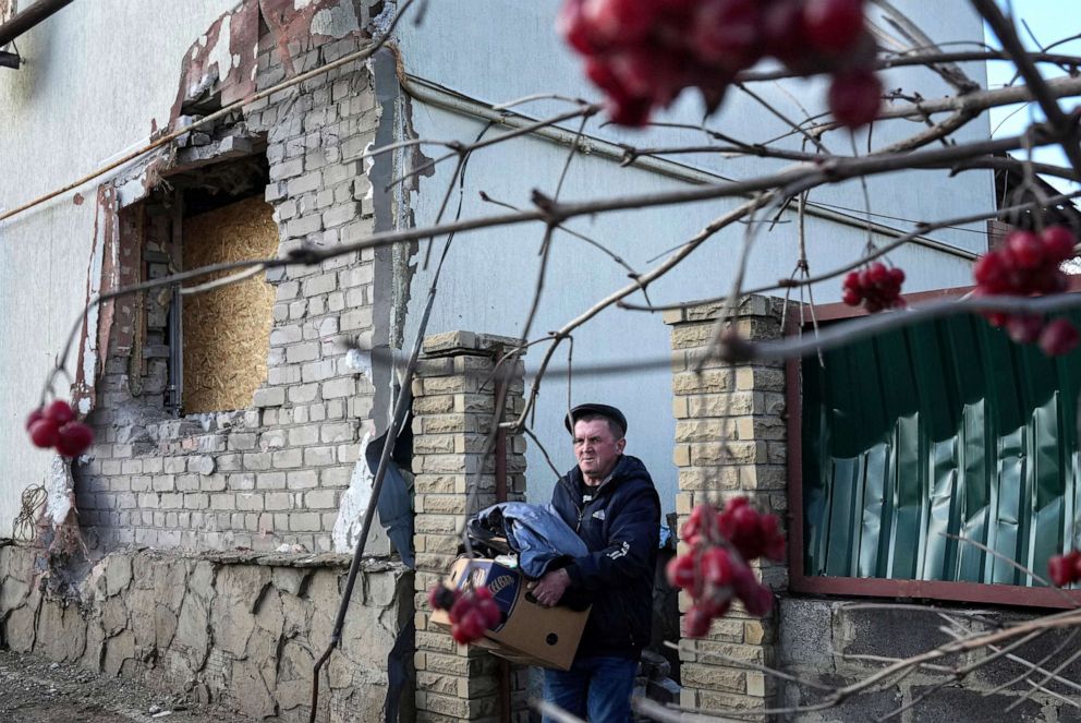 PHOTO: A man takes his things out of the house after damaged by artillery shelling in Novoluhanske, eastern Ukraine, on Feb. 23, 2022.