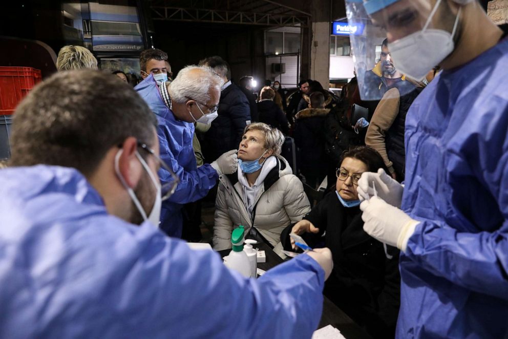 PHOTO: Ukrainian citizens and expatriates are being tested for COVID-19 upon arrival, in Athens, on Feb. 28, 2022.