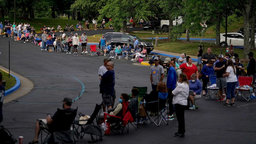 PHOTO: In this June 28, 2020, file photo, people line up outside Kentucky Career Center prior to its opening to find assistance with their unemployment claims in Frankfort, Ky.