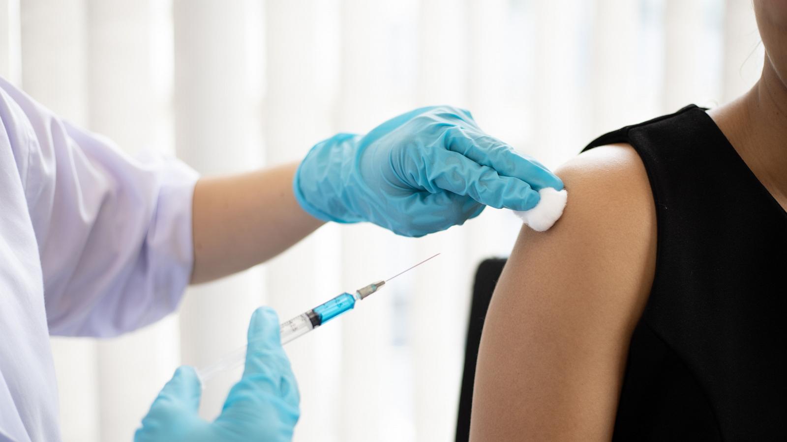 PHOTO: A health professional is seen vaccinating a person.