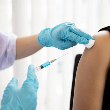 PHOTO: A health professional is seen vaccinating a person.