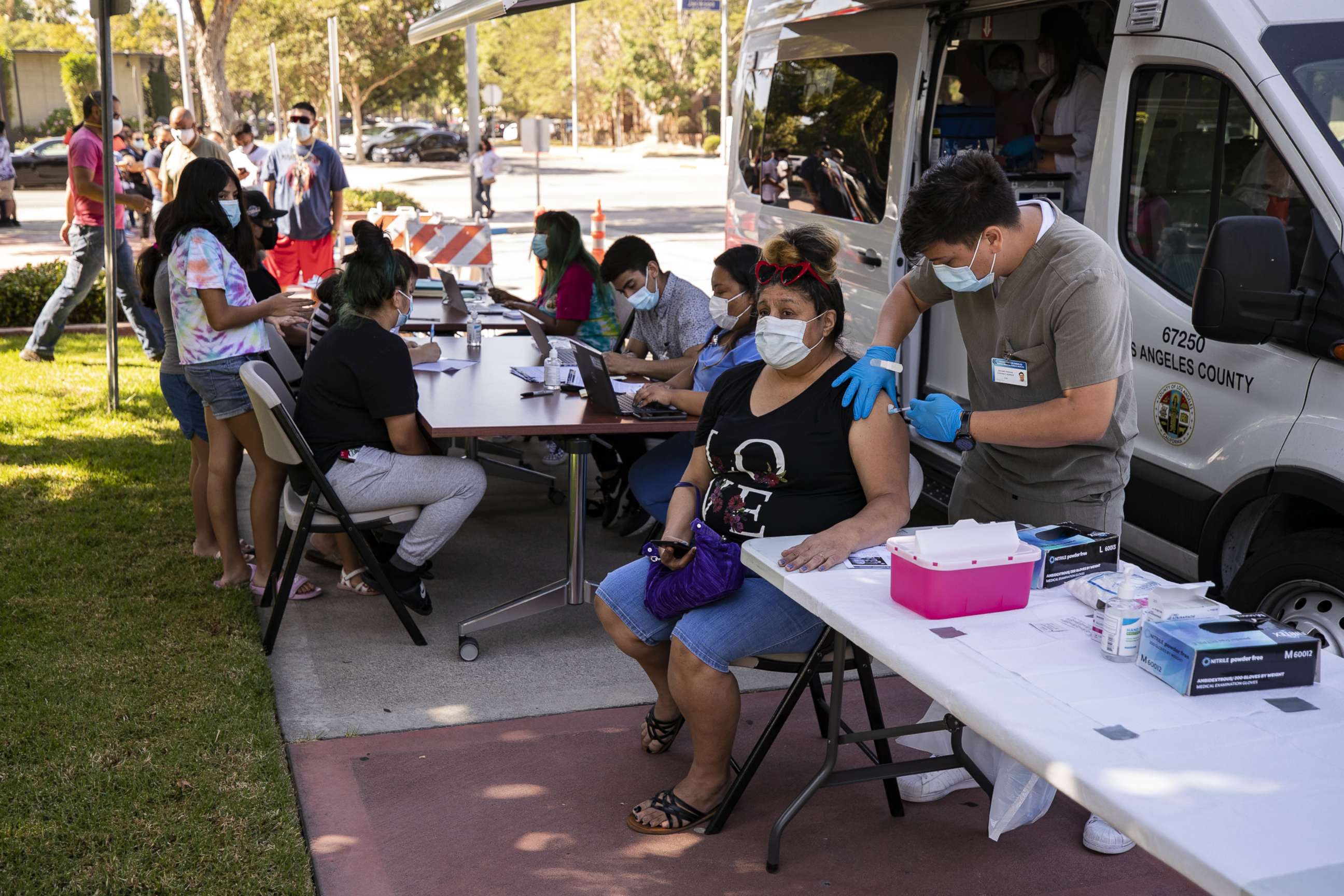 PHOTO: A woman gets vaccinated at a COVID-19 vaccination clinic in Paramount, Calif., Aug. 4, 2021.