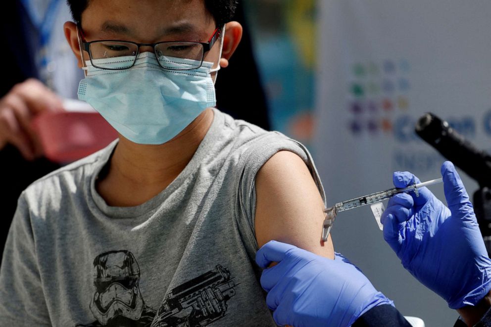 PHOTO: Brendan Lo, 13, receives a dose of the Pfizer-BioNTech COVID-19 vaccine at in New Hyde Park, N.Y., May 13, 2021.