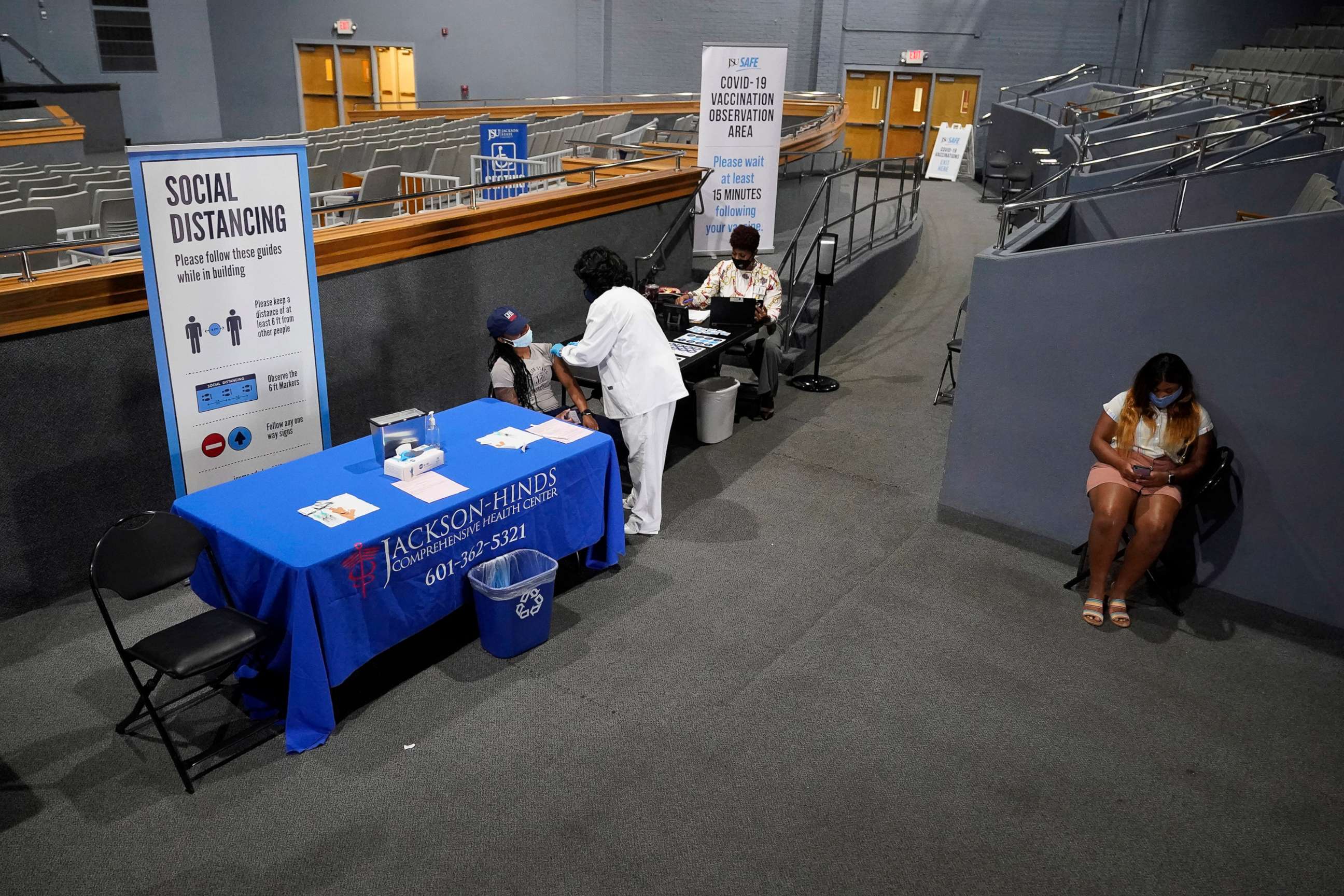 PHOTO: Social distancing recommendations are posted in the Rose E. McCoy Auditorium where COVID-19 vaccinations were being offered on the Jackson State University campus in Jackson, Miss., July 27, 2021.