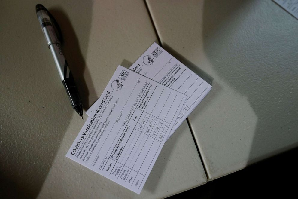 PHOTO: COVID-19 Vaccination Record Cards await patients at a coronavirus disease (COVID-19) vaccine clinic at La Colaborativa in Chelsea, Mass., Nov. 30, 2021. 