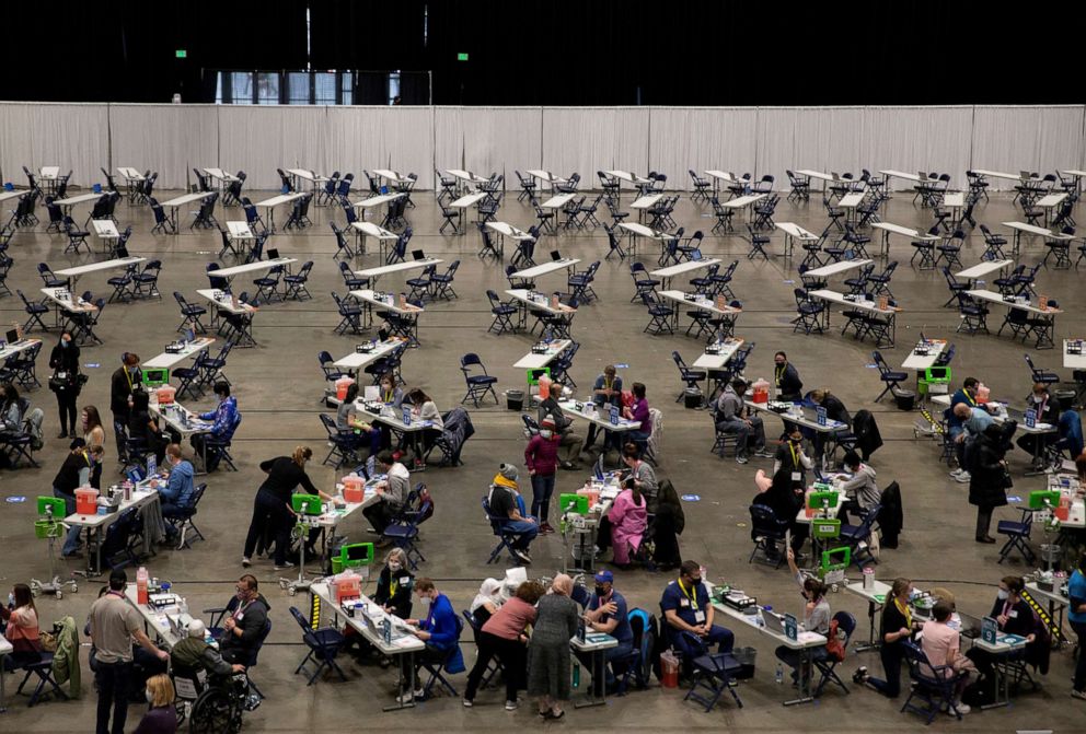 PHOTO: People receive COVID-19 vaccines at a mass vaccination site at Lumen Field Event Center in Seattle, March 13, 2021. 