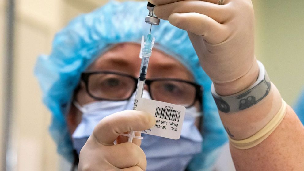 PHOTO: PORTLAND, OR - DECEMBER 16: A healthcare worker prepares COVID-19 vaccine doses at the Portland Veterans Affairs Medical Center on Dec. 16, 2020 in Portland, Oregon. The first rounds of Pfizer's vaccine were administered in Oregon on Wednesday.  