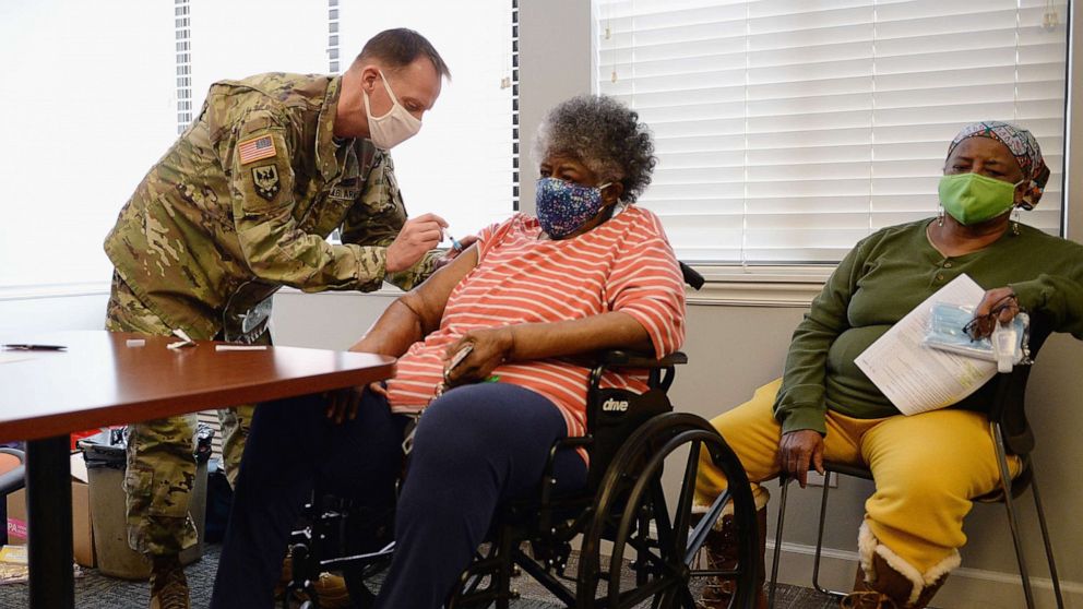 PHOTO: Staff Sergeant Herbert Lins of the Missouri Army National Guard administers the COVID-19 vaccine to a resident during a vaccination event on Feb. 11, 2021 at the Jeff Vander Lou Senior living facility in St Louis, Mo.