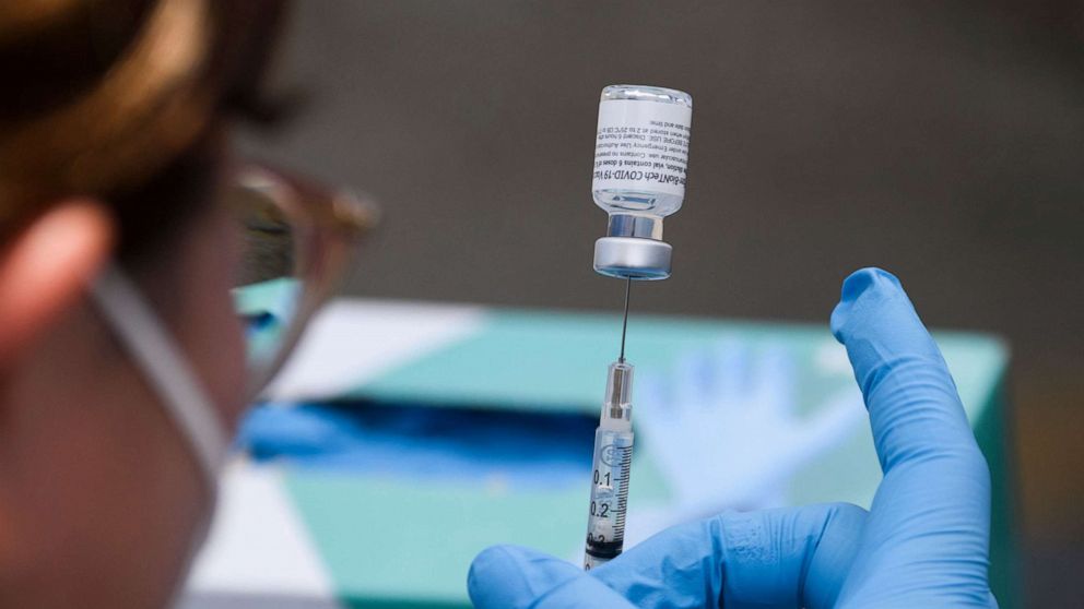 PHOTO: A syringe is filled with a dose of the Pfizer Covid-19 vaccine at a mobile vaccination clinic during a back to school event at the Weingart East Los Angeles YMCA in Los Angeles, Aug. 7, 2021.