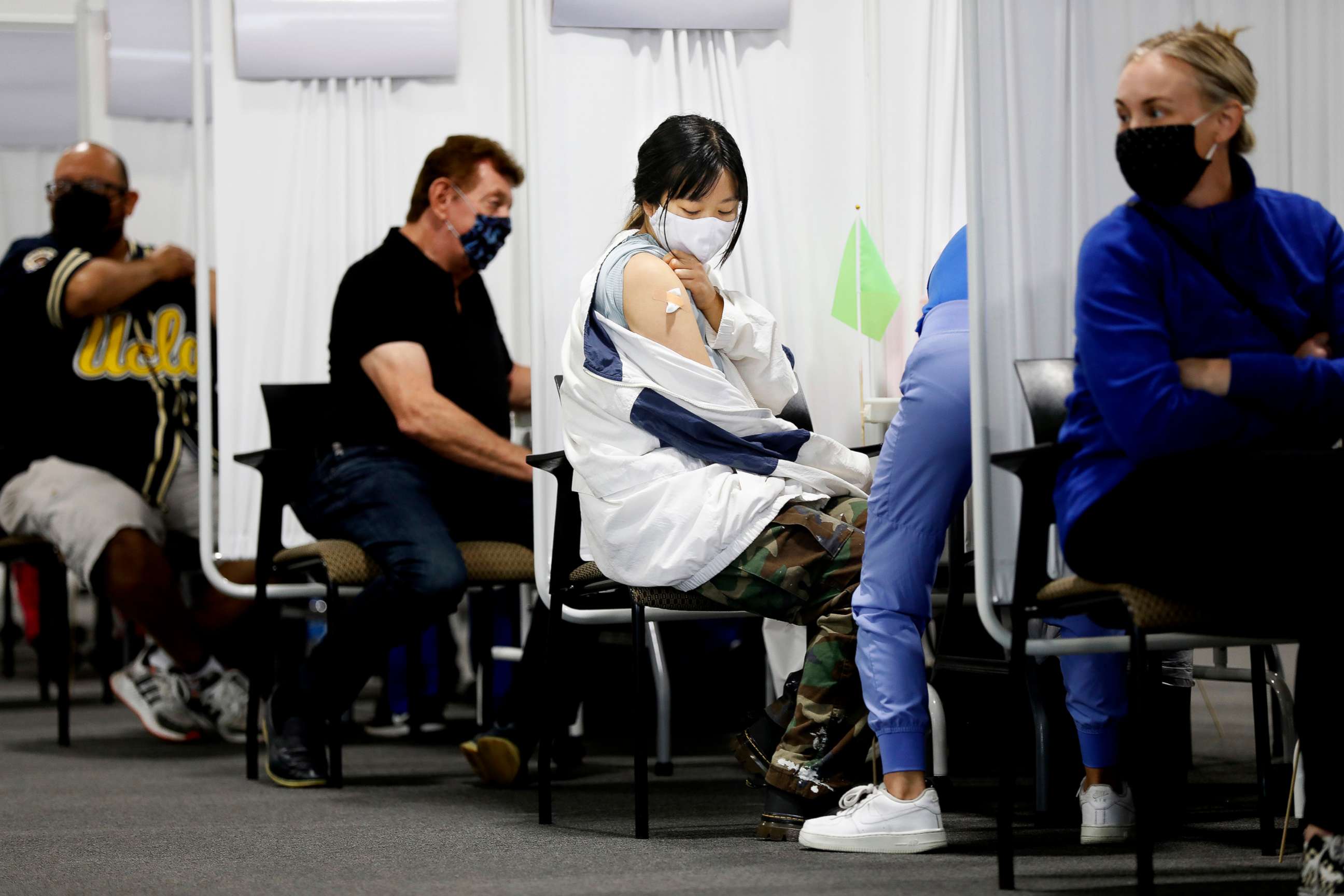 PHOTO: A woman receives a vaccine at a new mass vaccination site in Orange County, the Providence Vaccine Clinic at Edwards Lifescience in Santa Ana, Calif., April 22, 2021.