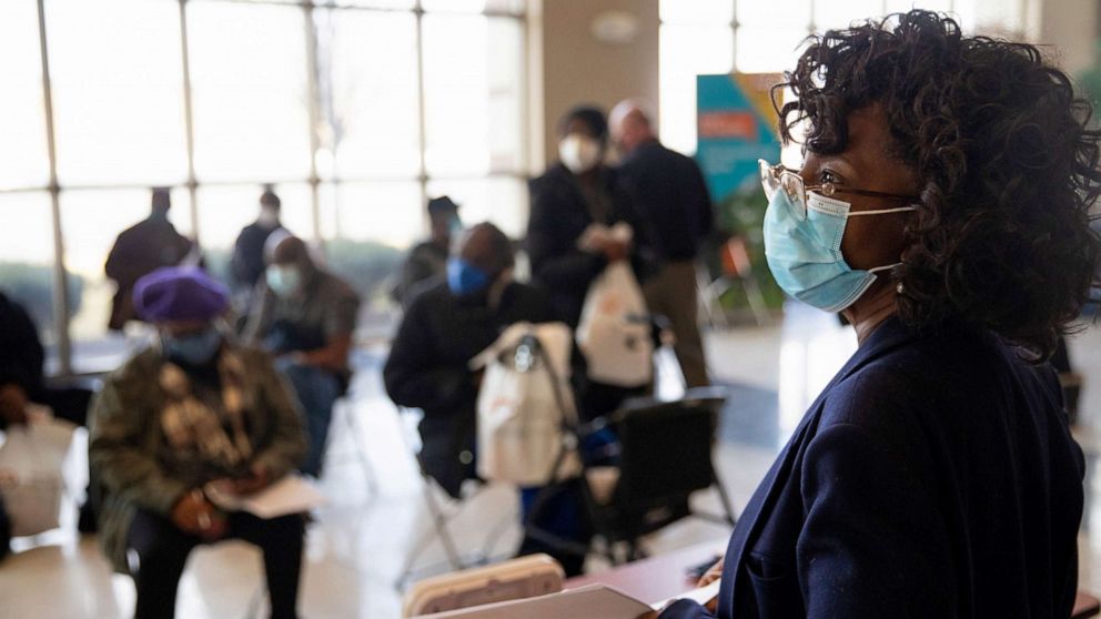 PHOTO: A nurse looks over the observation area as seniors wait after receiving their coronavirus disease (COVID-19) vaccinations at Second Ebenezer Church in Detroit, Feb. 27, 2021.