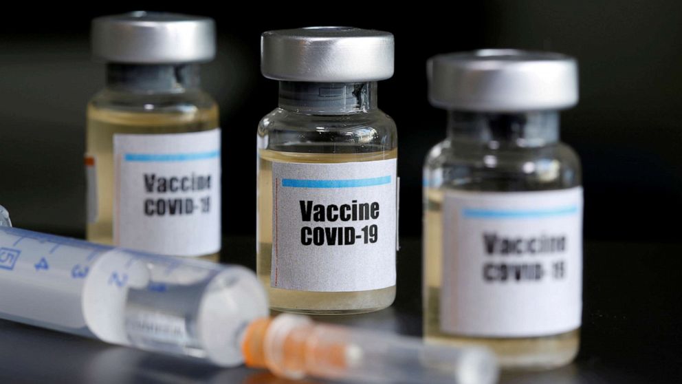 PHOTO: Small bottles labeled with a "Vaccine COVID-19" sticker alongside a medical syringe are seen in this illustration taken on April 10, 2020.